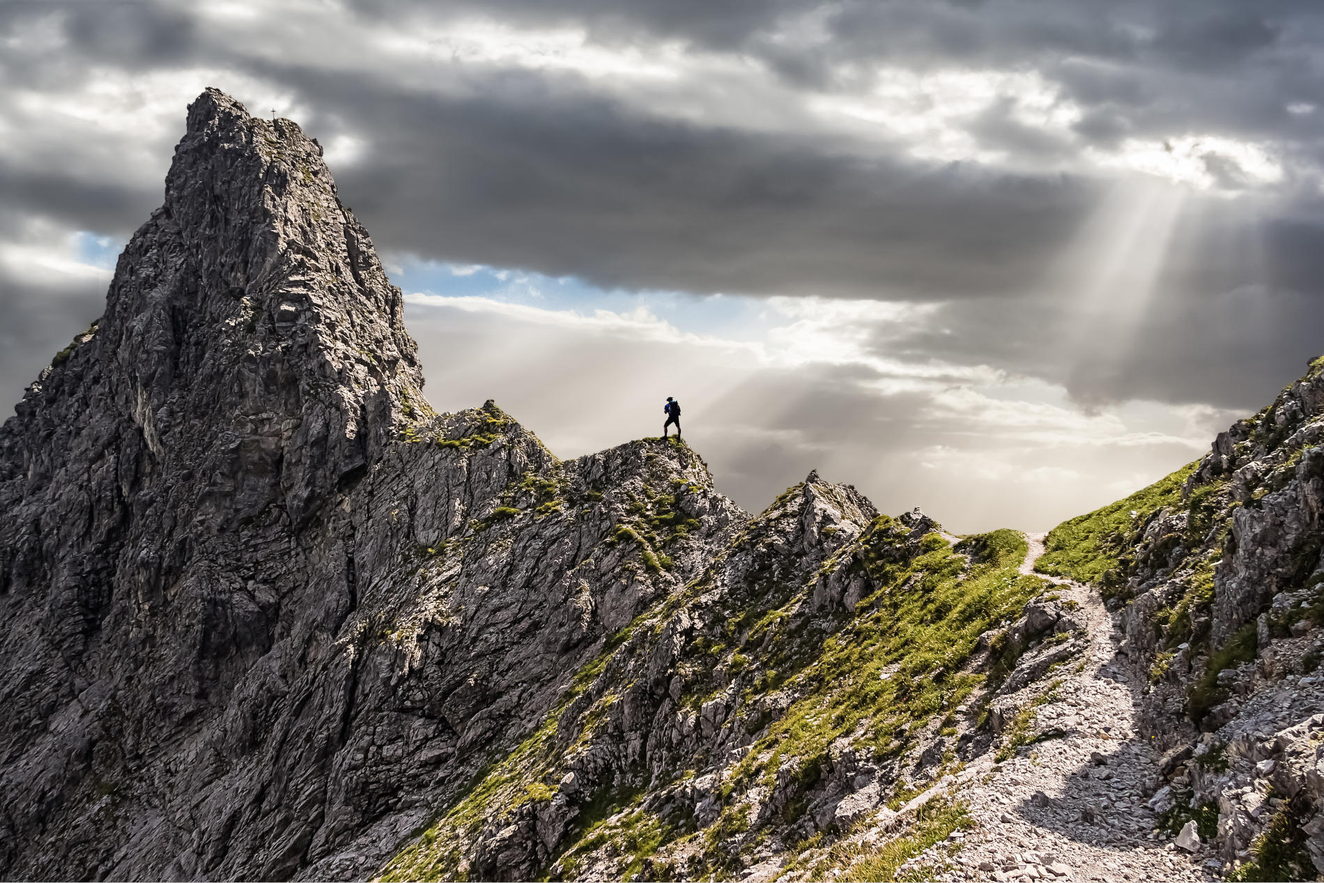 Image of person climbing a mountain