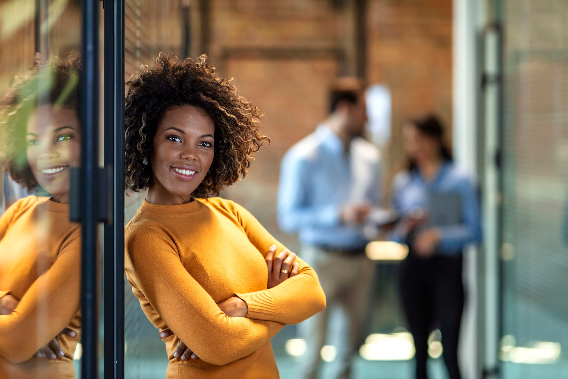 Image of woman in yellow sweater.